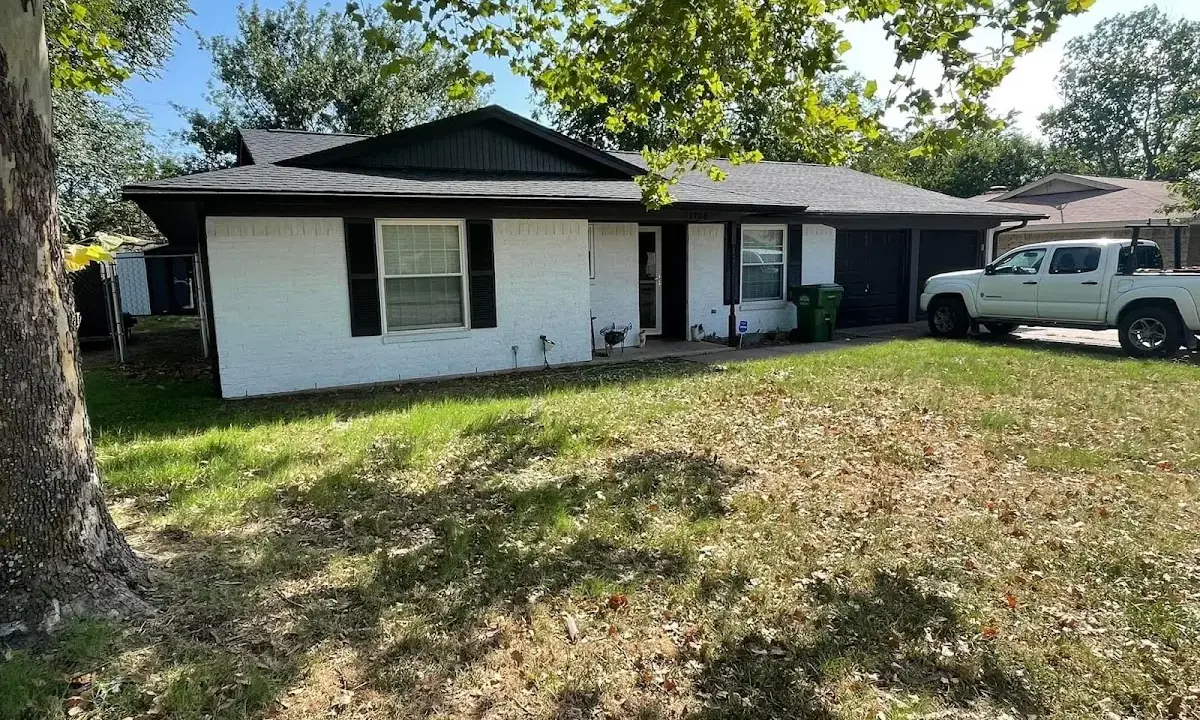 Professional roofing crew working on a residential roof in Belmont